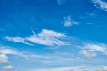 beautiful white cloud formation in bright blue sky as background