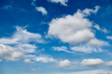 Naklejka na ściany i meble Big beautiful clouds in blue sky background