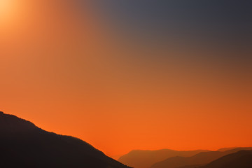 Obraz premium Mountains Landscape. Beautiful Mountain peaks at sunset. Panorama. Copy space