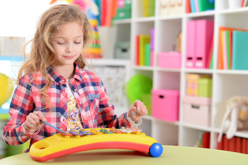 Close up portrait of happy beautiful girl playing
