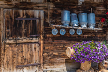 old wooden farmhouse with milk pots