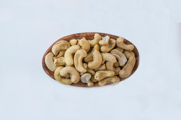 Roasted cashew nuts whith salt on white background