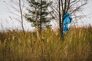 Blue plastic bag leave in tree. space for text.