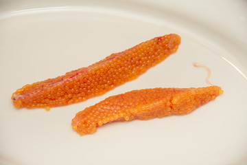 Orange caviar rye from trout fish   on a plate 