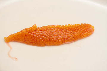 Orange caviar rye from trout fish   on a plate 