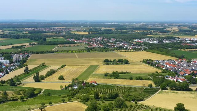 Aerial view of the castle Schloss Alsbach in Germany. On a sunny day in Summer. Pan to the right with view from the castle.