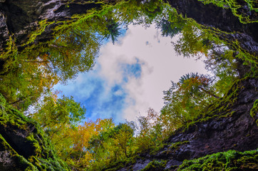 The entrance shaft of Scarisoara Cave, one of the biggest ice caves in the Apuseni Mountains, Romania.