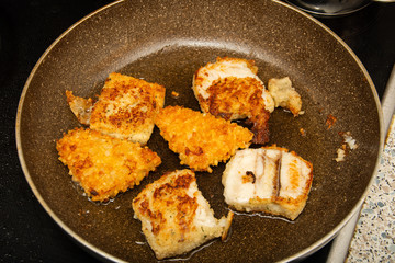 fish with egg and potatoes in the tray