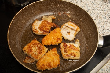 fish with egg and potatoes in the tray