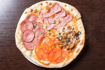 Cheap pizza 4 seasons. With ham, pepperoni, mushrooms, and tomatoes.
