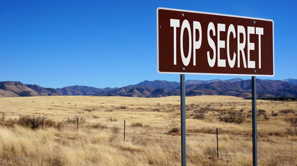 Top secret word on road sign