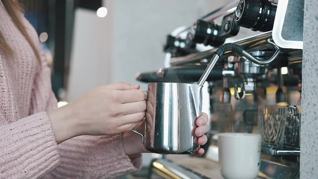 Fresh Black Coffee Pouring from Professional Machine Dispenser in Cup. 4K, Macro Slowmotion.
