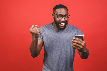 Photo of overjoyed black african american man knowing that he became winner of something so...