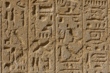 Egyptian ancient hieroglyphs on the stone wall