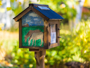 Little library with horses drawing in Spring