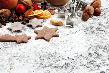 Baking christmas cookies. Typical cinnamon stars bakery with spices. xmas decoration on table