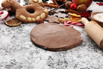 Baking christmas cookies. Typical cinnamon stars bakery with spices. xmas decoration on table