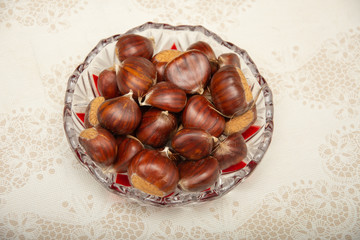 A small pile of chestnuts, conkers isolated 