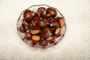 A small pile of chestnuts, conkers isolated 