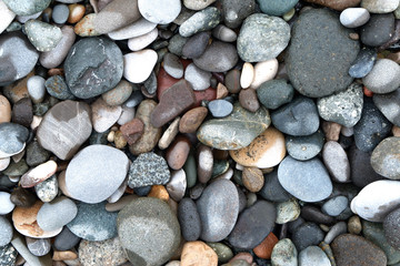 Close up of rounded and polished beach rocks