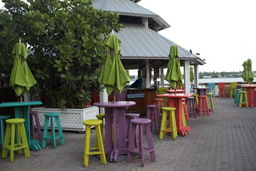 colorful tables and umbrellas at outdoors restaurant and bar