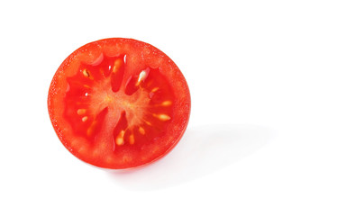 Cherry tomato cut in half isolated on white background, close up detail
