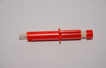 Red  Extractor for removing ticks,TICK TWISTER in a hand