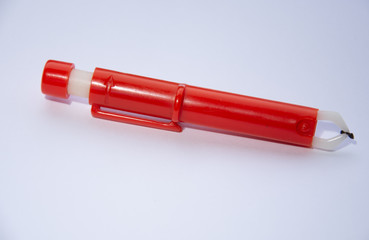 Red  Extractor for removing ticks,TICK TWISTER in a hand