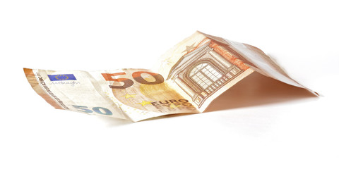 50 EUR banknote laying at desk, isolated on white background
