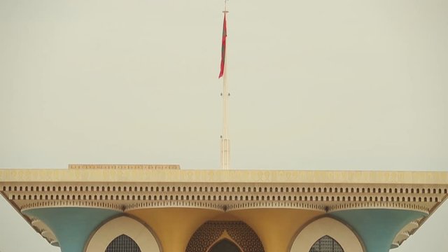 Oman. Al Alam Oman Palace, Muscat Governorate. Panorama of the details of the building. The palace of the king. Oman flag at the top