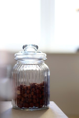 Hazelnuts in a jar on a table. Selective focus.