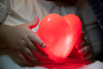 heart in the hands of a child closeup