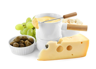 Pot of tasty cheese fondue and products isolated on white