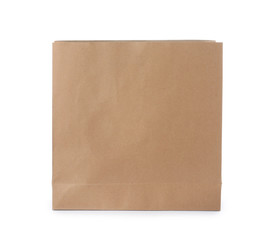 Empty craft paper bag isolated on white. Mockup for design