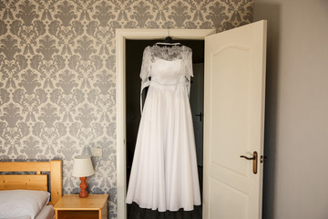 Fototapeta na wymiar Wedding dress in fitting room