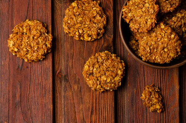 Pumpkin vegan oatmeal cookies with nuts on wooden