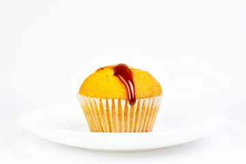 MUFFIN WITH HONEY ON WHITE BACKGROUND