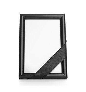 Funeral photo frame with black ribbon on white background. Space for design