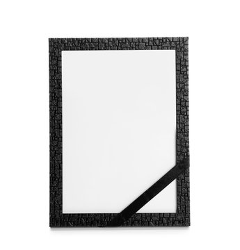 Funeral photo frame with black ribbon on white background. Space for design