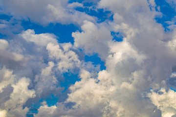 Blue sky with white clouds. Heaven. Cumulus. Cloudiness. Dreams. Weather forecast. Romance. Natural background. Background with clouds.