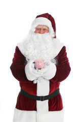 Santa Claus holding piggy bank on white background