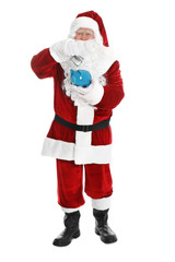 Santa Claus putting dollar banknote into piggy bank on white background