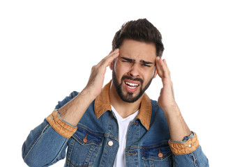 Man suffering from headache on white background