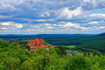 Beautiful sky with clouds over the ancient castle Burg Wernfels