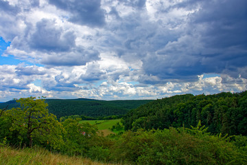 Beautiful sky with clouds over the ancient castle Burg Wernfels
