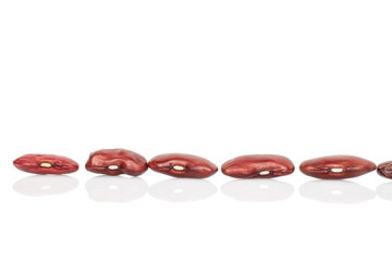 Group of five whole fresh red kidney beans isolated on white background