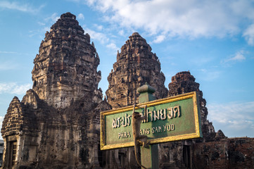 monkey hanging on a temple sign lopburi
