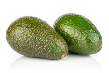 Group of two whole fresh green avocado isolated on white background