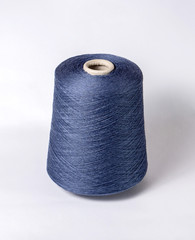 bobbin of yarn on a white background. Side view.Textile reel on isolated white background.