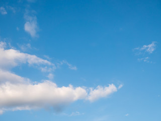 Naklejka na ściany i meble Blue sky with white clouds for text background.